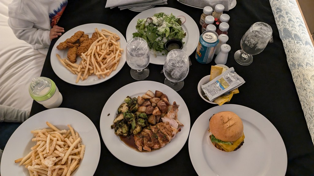 Room service meal ordered at The Joseph Hotel: chicken steak, salad, and French fries